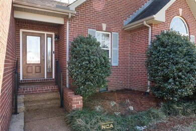All Brick home with covered entry and aggregate wa