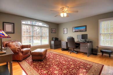 Living room with built-in cabinets, hardwood floor