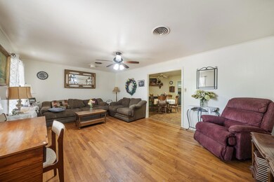 Living area with light wood-type flooring and a c