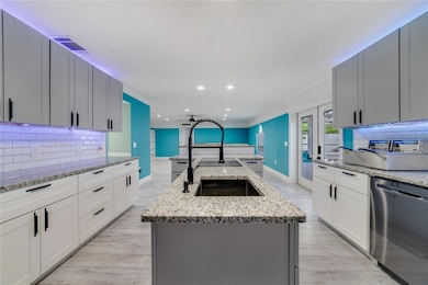 The home chef will fall in love instantly with the upgraded kitchen offering all black STAINLESS STEEL APPLIANCES, granite countertops, all new cabinets with soft close doors and drawers, DOUBLE WALL OVEN, a FARMHOUSE & CHEF’S SINK, subway tile backsplash, under and over cabinet LED LIGHTING and a huge cooking ISLAND with breakfast bar seating for casual dining and perfect for entertaining!