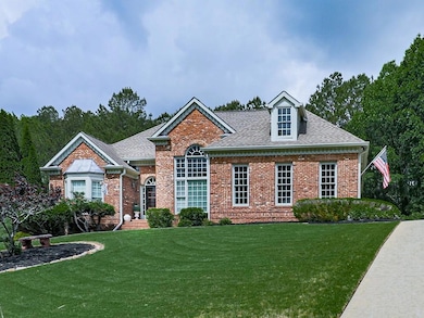 View of front of house with brick siding, roof wit