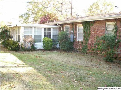 REAR VIEW SHOWING SUN ROOM ADDITION