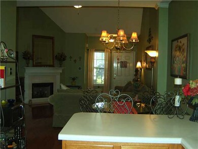 View of Greatroom and fireplace from kitchen - Ope