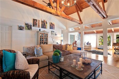 Living room showcasing a wood ceiling with exposed