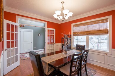 French doors open to warm dining room