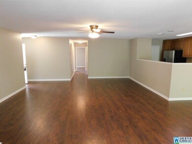 LARGE LIVING ROOM WITH NEW LAMINATE HARDWOOD FLOOR