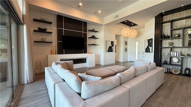 Living area with wood finished floors, baseboards,