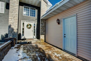 Front entryway features beautiful landscaping and 