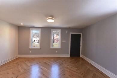 Living room showing entry door and looking out to 