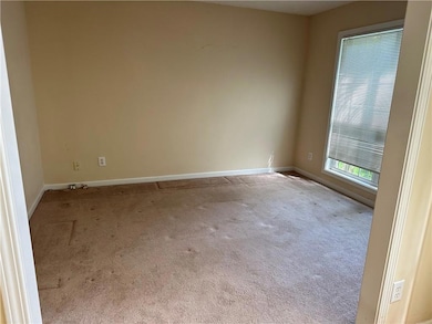 Spare room with carpet flooring and baseboards
