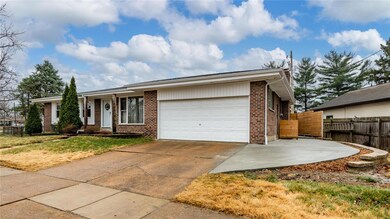 Concrete driveway and additional parking area.