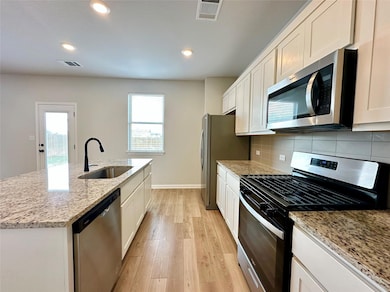 Kitchen featuring stainless steel appliances, a k