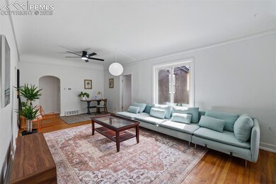 Living area featuring visible vents, arched walkwa