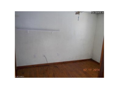 bedroom 1 w/ hardwood floors