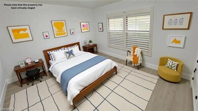 Bedroom with baseboards and light wood-type flooring