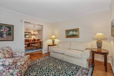 This parlor style living room offers a comfortable respite from the main area of the home and flow into the dining room.