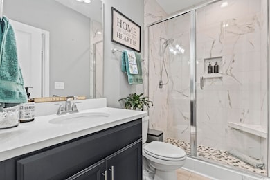 Bathroom featuring tile patterned flooring, toilet