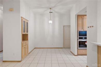 Unfurnished dining area featuring light tile patterned floors