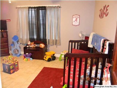 Spacious bedroom with tile floor