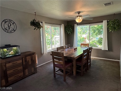Dining area featuring a textured ceiling, ceiling