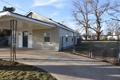 Circle drive and gated entrance to large yard