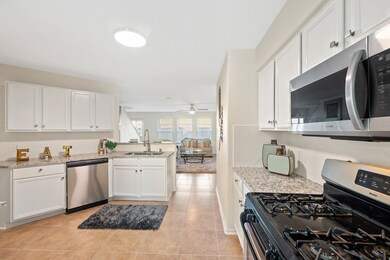 Enjoy a roomy kitchen that features new stainless steel appliances.