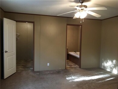 Unfurnished bedroom with ornamental molding, carp