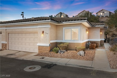 View of front facade with a garage, concrete drive
