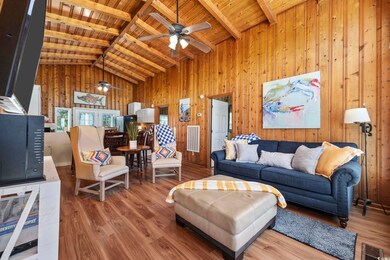 Living room with high vaulted ceiling, wooden ceil