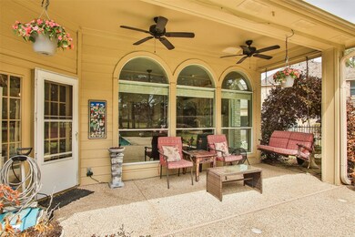 This shaded covered porch is poolside.