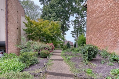 Building faces courtyard, path