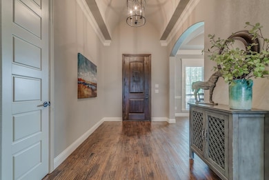 Beautiful space to greet guests.  8 ft front door with speak easy.  Barrel ceiling and crown molding!