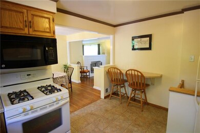 There is a newer ceramic tile floor and a breakfas