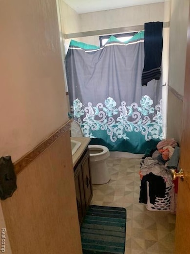 Full bathroom featuring vanity and shower / bath combo