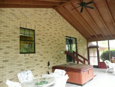 porch w/ vaulted wood and beam ceiling