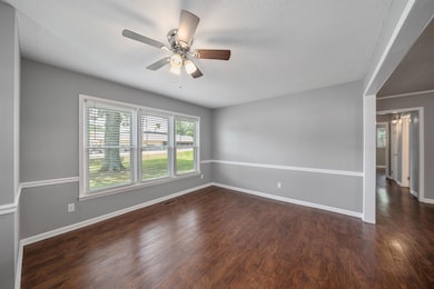 Unfurnished room with wood finished floors, a textured ceiling, and ceiling fan