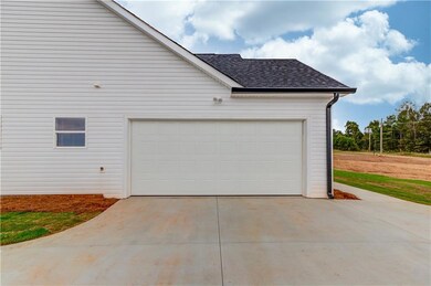 Garage featuring driveway