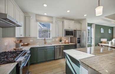 Bright kitchen with an expansive center island perfect for gatherings *Model representation
