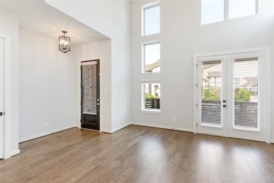 View of the entrance. Front door is equipped with keyless entry and ring doorbell.