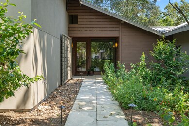 Enter into this Mid-Century Modern Bungalow while