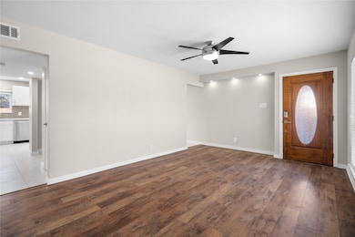 Entrance foyer with hardwood / wood-style floors and a ceiling fan