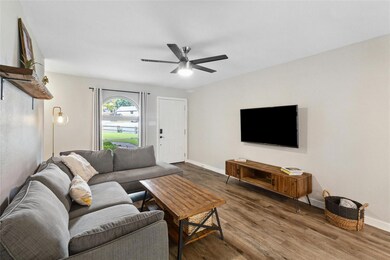 Living area with wood finished floors and a ceili