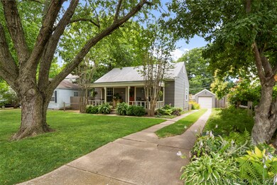 Desirable covered front porch, beautiful landscapi
