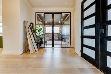 Enclosed by sleek black metal-framed double doors