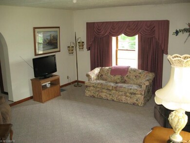Arched doorways and large windows in Living Room.