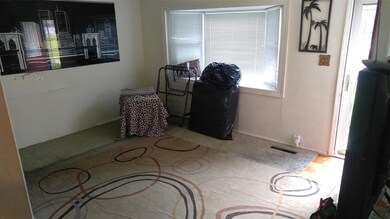 Spacious living room with bay window.