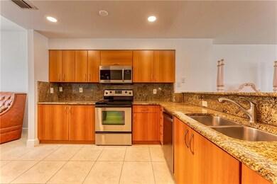 Granite countertops and large double sinks in kitc