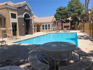 Community pool with a patio area