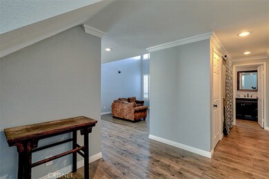 Entryway to remodeled guest bathroom and living room