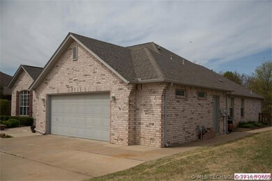 Sidewalks run from the back patio to the garage.